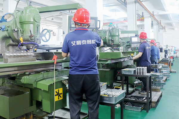 Worker machining ball valve stem