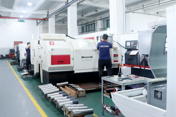 Worker processing stainless steel valve stem